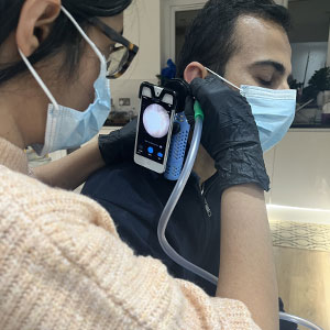 professional ear cleaning with miscrosuction tools and oto-endoscope